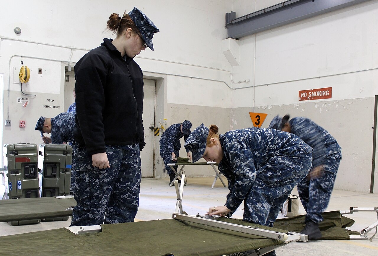 File photo: Navy personnel assemble a cot during a hurricane-readiness exercise at Naval Weapons Station Yorktown, Virginia, in April 2015. Illustrative context; not a photograph of the reported event.